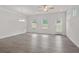 Bright living room features hardwood floors, a ceiling fan, and large windows at 317 Skye Ln # 51, Cartersville, GA 30121