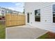 This home features a concrete patio with a wooden fence, perfect for enjoying the outdoors in privacy at 317 Skye Ln # 51, Cartersville, GA 30121