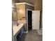 Bathroom featuring a modern vanity with neutral colors, stylish backsplash, and sleek fixtures, creating a calming atmosphere at 8827 Lake Rd, Union City, GA 30291