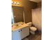 Bathroom featuring single vanity, toilet, and shower-tub combo offering functionality and modern convenience at 8827 Lake Rd, Union City, GA 30291