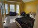 This bedroom features a bay window, vaulted ceiling, and carpet at 8827 Lake Rd, Union City, GA 30291