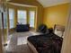 This bedroom features a bay window, vaulted ceiling, and carpet at 8827 Lake Rd, Union City, GA 30291