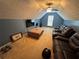 Upstairs bonus room featuring plush carpeting, large television, and comfortable seating arrangements at 8827 Lake Rd, Union City, GA 30291