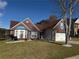 Attractive brick home with a two-car garage, complemented by a well-kept lawn and blue accents at 8827 Lake Rd, Union City, GA 30291
