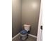 Compact half bathroom with a toilet, neutral wall color, and clean lines offering functionality and modern convenience at 8827 Lake Rd, Union City, GA 30291