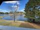 Breathtaking view of the lake surrounded by lush greenery, offering a serene natural backdrop at 8827 Lake Rd, Union City, GA 30291
