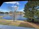 Breathtaking view of the lake surrounded by lush greenery, offering a serene natural backdrop at 8827 Lake Rd, Union City, GA 30291