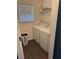 This laundry room features a washer, dryer, utility shelf, window and a laundry basket for your convenience at 8827 Lake Rd, Union City, GA 30291