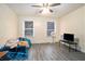Bedroom featuring great sunlight, wood-look flooring, ceiling fan at 417 Ridge Creek Dr, Clarkston, GA 30021