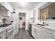 Well-lit kitchen with ample counter space, white cabinets, and updated appliances at 417 Ridge Creek Dr, Clarkston, GA 30021