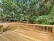 New backyard deck with wood railings, overlooking the private fenced-in backyard at 5 Ridgewood Cir, Mcdonough, GA 30252