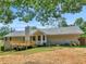 Backyard with a deck, well maintained lawn, and mature trees at 5 Ridgewood Cir, Mcdonough, GA 30252