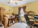 Bedroom featuring yellow walls, one window, a ceiling fan, and carpet floors at 5 Ridgewood Cir, Mcdonough, GA 30252