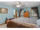 Spacious bedroom featuring wood accents, large windows, and a view to an adjoining bathroom at 5 Ridgewood Cir, Mcdonough, GA 30252