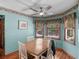 Inviting dining room with scenic views, hardwood floors, and natural light at 5 Ridgewood Cir, Mcdonough, GA 30252