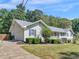 Charming single-story home with blue shutters, attached garage and landscaped front yard at 5 Ridgewood Cir, Mcdonough, GA 30252