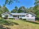 Charming single-story home with well-maintained lawn, stone accents, and inviting curb appeal at 5 Ridgewood Cir, Mcdonough, GA 30252