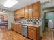 Functional kitchen with ample storage, stainless steel dishwasher, and access to the laundry room at 5 Ridgewood Cir, Mcdonough, GA 30252