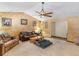 Cozy living room with plush seating, accent walls, and comfortable carpet at 5 Ridgewood Cir, Mcdonough, GA 30252