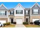 Exterior elevation of townhomes with brick and gray siding at 5634 Union Pointe Dr, Union City, GA 30291