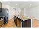 Kitchen area showcasing stainless steel appliances, an island sink and a view of the dining and living space at 5634 Union Pointe Dr, Union City, GA 30291