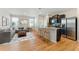 Open-concept living space featuring hardwood floors, modern furnishings, and a stylish kitchen area at 5634 Union Pointe Dr, Union City, GA 30291