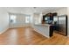 Bright living area showcasing hardwood floors, stainless appliances and an open floor plan at 5634 Union Pointe Dr, Union City, GA 30291