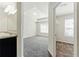 Spacious main bedroom showing en-suite bath and walk-in closet with neutral walls and carpet at 5634 Union Pointe Dr, Union City, GA 30291