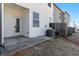 Back patio with door and small window, and a partial view of the backyard at 5634 Union Pointe Dr, Union City, GA 30291