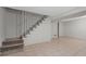 Basement area featuring tiled floors, stairs, and white walls at 1513 Spruce Ridge Way, Stone Mountain, GA 30083