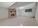 The basement features a stone fireplace, shelving, and tile flooring at 1513 Spruce Ridge Way, Stone Mountain, GA 30083