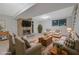 Spacious basement den area with stone fireplace, tile floors and comfortable seating at 1513 Spruce Ridge Way, Stone Mountain, GA 30083