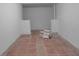 Unfinished basement space showcases tiled floor at 1513 Spruce Ridge Way, Stone Mountain, GA 30083