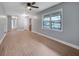 Bright living room features new floors, ceiling fan, and a large picture window at 1513 Spruce Ridge Way, Stone Mountain, GA 30083