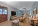 Inviting living room with wood floors, ceiling fan, soft blue walls and comfortable seating at 1513 Spruce Ridge Way, Stone Mountain, GA 30083