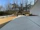 Spacious backyard with a concrete court, basketball hoop, and a gazebo, perfect for outdoor activities at 1763 Emerald Dr, Jonesboro, GA 30236