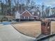 Exterior view of a two-story brick home with an extended driveway and manicured front lawn at 1763 Emerald Dr, Jonesboro, GA 30236