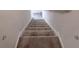 Carpeted staircase leading upwards, providing a seamless transition between floors in the home at 1763 Emerald Dr, Jonesboro, GA 30236