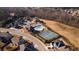 Aerial view showcasing the community pool, tennis courts and clubhouse in a Gathering-friendly neighborhood at 2650 Longacre Park Way, Lawrenceville, GA 30044