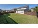 Well-maintained backyard with lush green grass, landscaping, and privacy fence at 2650 Longacre Park Way, Lawrenceville, GA 30044