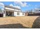 Large backyard and covered patio extending the living space outdoors at 2650 Longacre Park Way, Lawrenceville, GA 30044