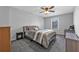 Comfortable bedroom with neutral tones, ceiling fan, window, and ample space for furniture at 2650 Longacre Park Way, Lawrenceville, GA 30044