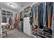 Spacious walk-in closet with custom shelving, drawers, and ample storage space for clothes and accessories at 2650 Longacre Park Way, Lawrenceville, GA 30044