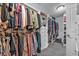 Large walk-in closet offers abundant hanging space, built-in drawers, and shelving for optimal organization at 2650 Longacre Park Way, Lawrenceville, GA 30044