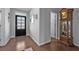 Stylish entry with a decorative front door, hardwood flooring, and nice decor at 2650 Longacre Park Way, Lawrenceville, GA 30044