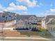 Beautiful two-story home with manicured lawn, lovely landscape and charming front porch at 2650 Longacre Park Way, Lawrenceville, GA 30044