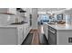 Modern kitchen featuring stainless steel appliances, white cabinets, and eat-in island at 2650 Longacre Park Way, Lawrenceville, GA 30044