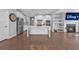 Bright kitchen with stainless steel appliances, a center island, and hardwood floors at 2650 Longacre Park Way, Lawrenceville, GA 30044