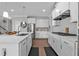 Bright kitchen with stainless steel appliances, center island, and hardwood floors at 2650 Longacre Park Way, Lawrenceville, GA 30044
