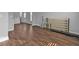 Living room featuring hardwood floors, a mirror and metal accents at 2650 Longacre Park Way, Lawrenceville, GA 30044